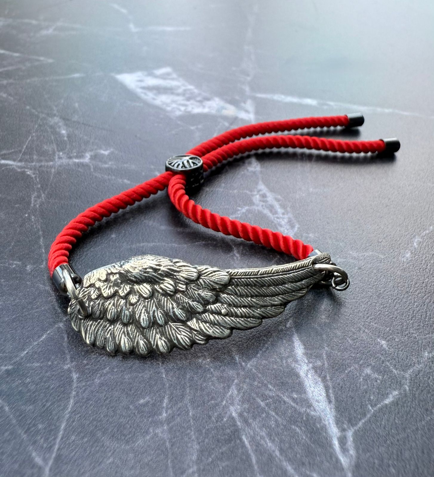 Pulsera ala plateada